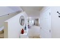 Bright foyer featuring a staircase, white walls, decorative mirror, and access to living areas at 507 Southwick Pl, Mebane, NC 27302