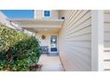 Charming front porch with a 'Welcome' mat, bench, and lush greenery for a cozy entrance at 507 Southwick Pl, Mebane, NC 27302