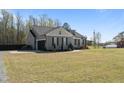 Spacious home with attached garage, showcasing ample parking and neutral siding at 511 Mcarthur Rd, Broadway, NC 27505