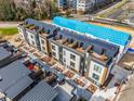 Modern townhomes with rooftop patios, walkways, and updated landscaping at 512 Gordon St # 404, Durham, NC 27701