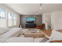 Modern living room featuring a decorative wall and an open-concept layout at 6926 Leesville Rd, Raleigh, NC 27613