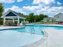 Stunning community pool area with ample lounge seating and a covered pavilion at 732 Georgia'S Landing Pkwy # 8, Raleigh, NC 27603