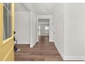 Inviting hallway featuring hardwood floors, neutral paint, and open floor plan at 75 Eltham, Rocky Mount, NC 27804
