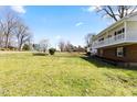 Expansive yard with a view of the two-story home and surrounding greenery at 1101 Driftwood Dr Dr, Siler City, NC 27344