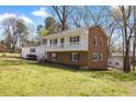 Angle view of a two-story home with brick foundation and a covered porch at 1101 Driftwood Dr Dr, Siler City, NC 27344