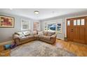 Cozy living room with hardwood floors, a comfortable couch and lots of natural light at 1213 Lincoln St, Durham, NC 27701