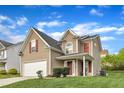 Charming two-story home features red shutters, attached garage, and a well-manicured lawn on a sunny day at 1320 Rushing Creek Pkwy, Raleigh, NC 27610