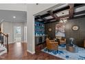 Inviting living room with coffered ceilings, a bar area and stylish decor at 1824 Longmont Dr, Wake Forest, NC 27587