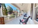 Inviting porch with rocking chairs, offering a relaxing outdoor space to enjoy the neighborhood views at 238 N Main St, Wake Forest, NC 27587