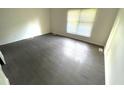 This is a bedroom with laminate floors and one window allowing for lots of natural light at 2809 Haven Rd, Raleigh, NC 27610