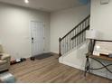Inviting entryway with hardwood floors, staircase, and stylish console table at 307 King Closer Dr, Cary, NC 27519