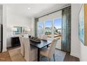 Charming dining room with large windows, a modern table, and stylish décor at 3102 Kempthorne Rd # 49, Cary, NC 27519