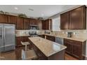 Well-equipped kitchen features a granite island, stainless steel appliances, and ample cabinet space at 3925 Massey Pointe Ct, Raleigh, NC 27616
