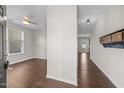 Inviting foyer with hardwood floors, neutral paint, and coat rack at 4044 Dunkirk Dr, Burlington, NC 27215