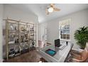 Bright home office featuring modern shelving, a sleek desk, and a comfortable seating area at 4044 Dunkirk Dr, Burlington, NC 27215