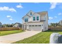 Charming two-story home with a well-manicured lawn and a two car garage at 4104 Ralph Holt Ct, Snow Camp, NC 27349