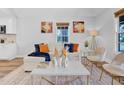 Bright living room featuring a stylish couch, modern decor, and a neutral color palette for a serene ambiance at 602 Gray Ave, Durham, NC 27701