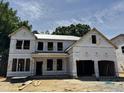New construction two-story home showcasing its framing and architectural design elements in a suburban community at 740 Portland Rose Dr, Knightdale, NC 27545