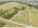 Wide aerial view of the property and neighborhood, showcasing vast land and trees at 10 Chaney Ln, Louisburg, NC 27549