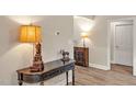 Lovely entryway showcases stylish decor and sleek wood-look flooring at 100 Hillside Village Dr, Louisburg, NC 27549