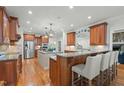 Spacious kitchen with stainless steel appliances, granite countertops, and a breakfast bar at 1009 High Trail Ct, Wake Forest, NC 27587