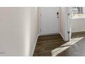 View of the entryway and front door, featuring luxury vinyl plank floors at 1100 Ursa Major Ct, Wendell, NC 27591