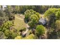 Expansive property featuring a stately home, mature trees, and a charming garden at 1188 Turner Rd, Creedmoor, NC 27522