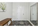 Welcoming entryway features wood flooring, a decorative rug, a table, and an ornate mirror on the wall at 1208 Wind Rose Dr, Fuquay Varina, NC 27526