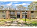 View of the apartment building and landscaped grounds at 1283 Schaub Dr # B, Raleigh, NC 27606