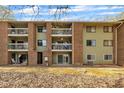 View of the apartment building's balconies and green painted brick exterior at 1283 Schaub Dr # B, Raleigh, NC 27606