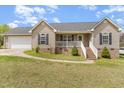 Charming single-Gathering home with light beige siding, complemented by a well-maintained green lawn at 141 Saige Ct, Burlington, NC 27217