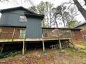 The backyard features a wooden deck overlooking the yard at 1505 Harth Dr, Garner, NC 27529