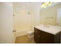 Bright bathroom with a modern vanity, stylish fixtures, and a clean, well-maintained shower-tub combination at 1505 Harth Dr, Garner, NC 27529