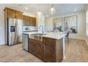 Farmhouse kitchen with stainless steel appliances, center island, and pendant lighting at 1513 Tamarisk Ln, Durham, NC 27703
