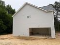 Side view of home showing the two car garage at 1945 Cranes Creek Rd, Cameron, NC 28326