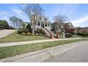 Charming home featuring a well-maintained lawn and an inviting front porch and walkway at 227 Walford Way, Cary, NC 27519