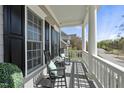 Inviting porch with rocking chairs, creating a relaxing outdoor living space at 227 Walford Way, Cary, NC 27519