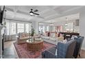 Spacious living room with ample seating, a large area rug, and natural light creates a comfortable and inviting atmosphere at 323 Augusta Pond Way # 171, Raleigh, NC 27603