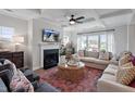 Bright living room with coffered ceiling, fireplace, and plush seating offers a cozy and stylish gathering space at 323 Augusta Pond Way # 171, Raleigh, NC 27603