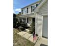 Close-up of a charming home showcasing a well-maintained yard and American flag accent at 3316 Perkins Ridge Rd, Raleigh, NC 27610