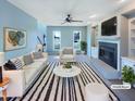Bright living room features a cozy fireplace, built-in shelving, and neutral decor for a comfortable atmosphere at 357 Riverwood Dr, Clayton, NC 27527