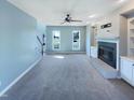 Bright living room features a cozy fireplace, built-in shelving, and neutral decor for a comfortable atmosphere at 357 Riverwood Dr, Clayton, NC 27527