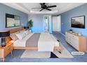 Spacious main bedroom with a ceiling fan, rug, and large bed, virtually staged at 357 Riverwood Dr, Clayton, NC 27527