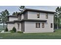 Exterior features mixed siding, sleek windows, and verdant landscaping at 3908 Cedar Knolls Dr, Youngsville, NC 27596