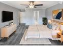 This bedroom features neutral gray walls, carpet, ceiling fan, and is virtually staged at 4216 High Mountain Dr, Raleigh, NC 27603