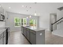 Stylish kitchen with stainless appliances, a central island, and bright, open layout at 55 Cordoba Dr, Franklinton, NC 27525