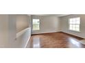 Bright bedroom with hardwood floors, white trim, and lots of natural light at 613 Ashburn Ln, Durham, NC 27703