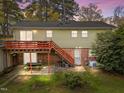 Backyard features include a deck, stairs, brick patio, and a small grill, perfect for outdoor entertaining at 6216 Lewisand Cir, Raleigh, NC 27615