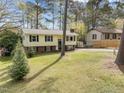 Two-story house with a well-maintained lawn. Offers nice curb appeal at 6216 Lewisand Cir, Raleigh, NC 27615