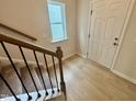 Tiled entryway and staircase with a window at 76 Commons Cir, Clayton, NC 27520